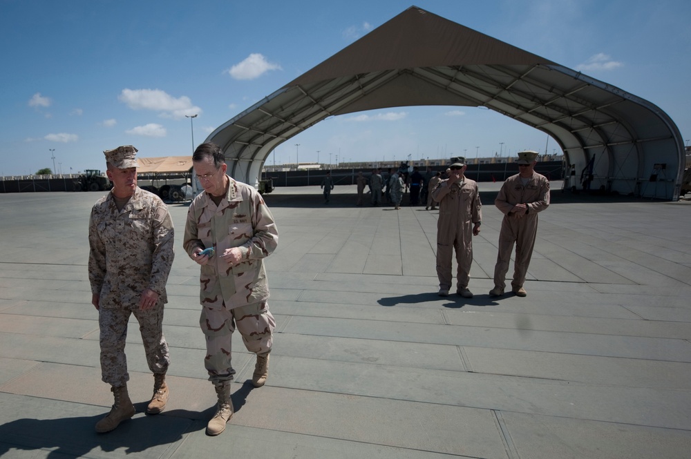Adm. Mike Mullen speaks with Commander of Joint Task Force Horn of Africa Rear Adm. Brian L. Losey.