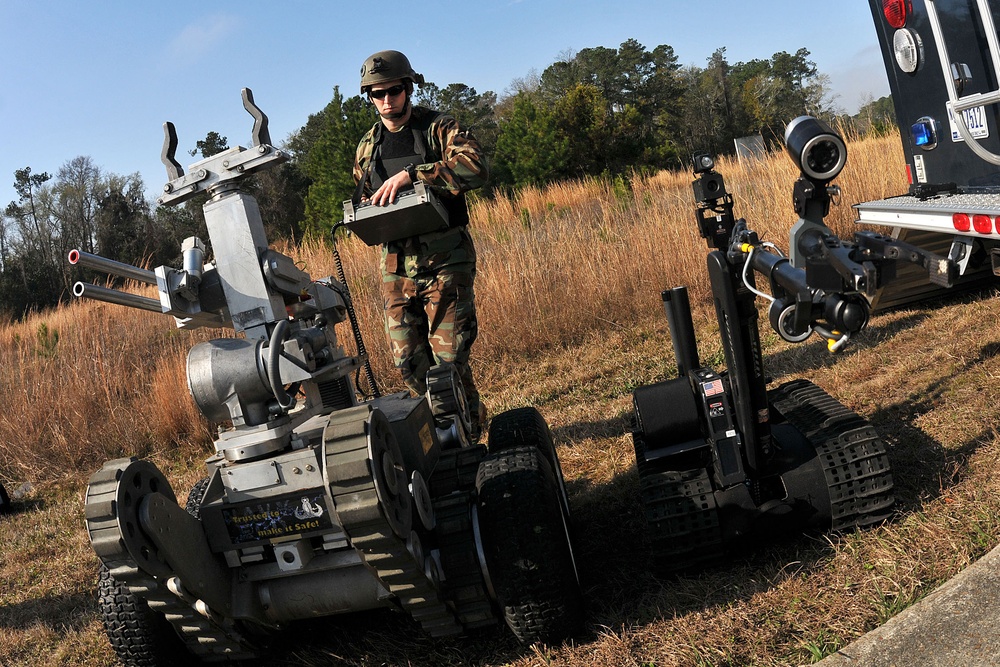 Chief Petty Officer Rich Mcave operates a Talon robot and a Remote Ordnance Neutralization System.