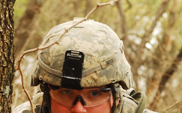 Pvt. Zach Mecthel watches for enemy movement during training at Fort Hood.