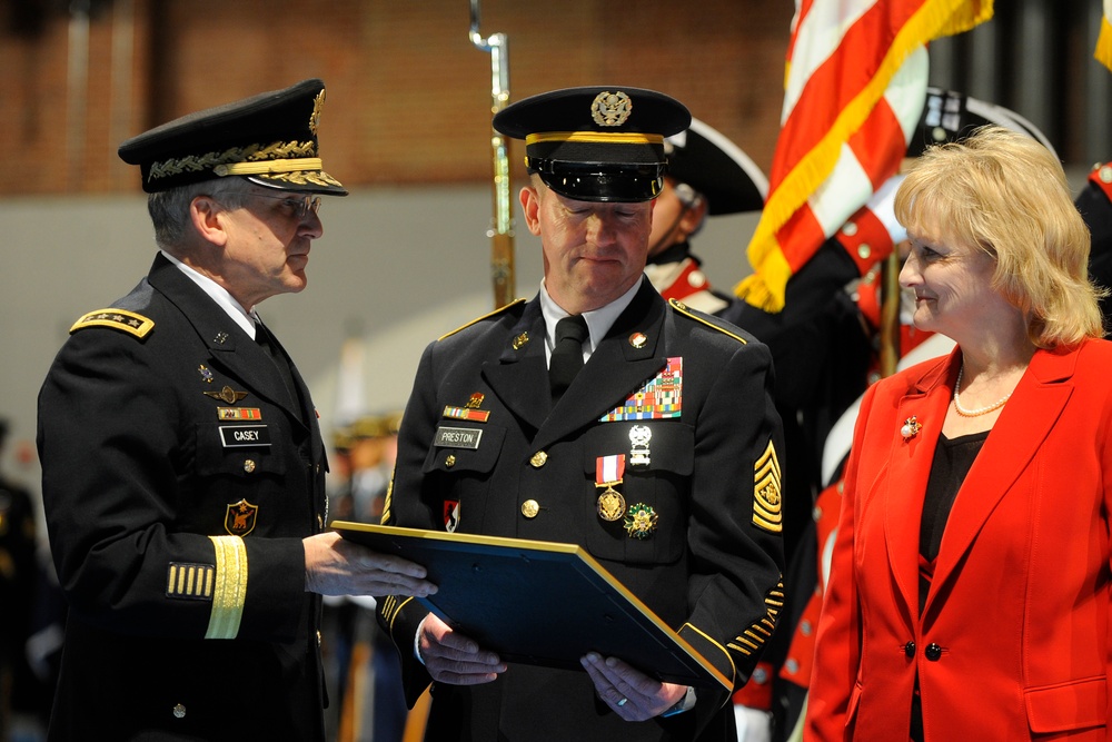 Sergeant Major of the Army Kenneth O. Preston receives an award during his retirement ceremony.