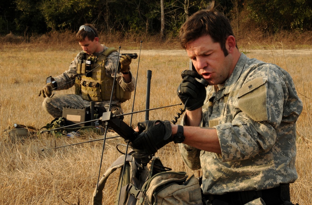 U.S. Army soldiers call in an operation schedule.