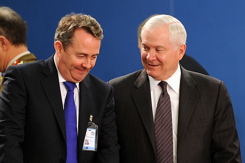 Secretary Gates speaks with British Defense Minister Liam Fox.