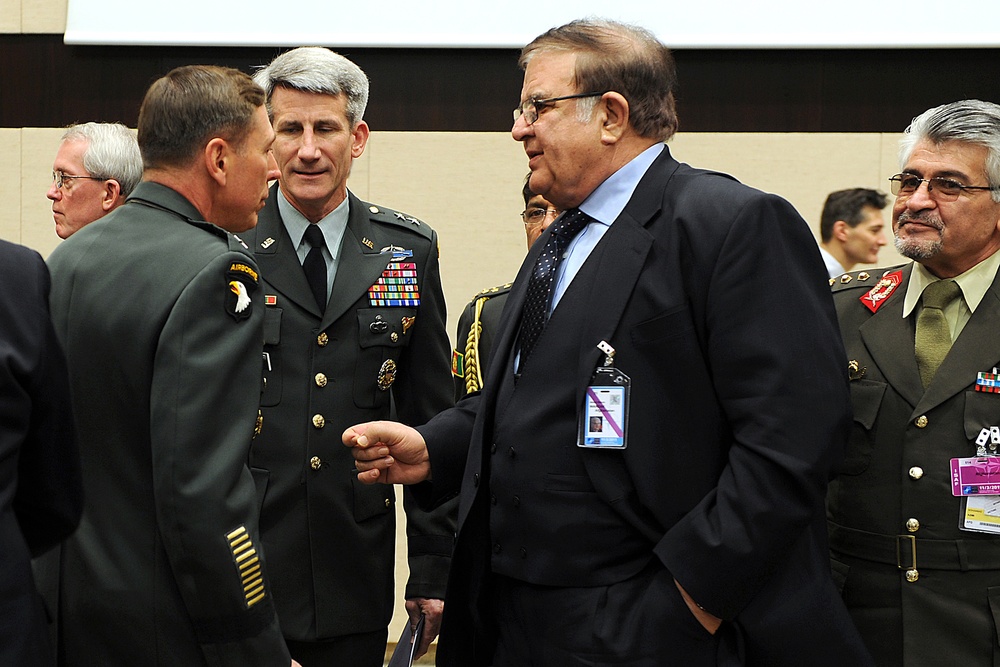 Defense Minister of Afghanistan Abdul Rahim Wardak speaks with Gen. David H. Petraeus.