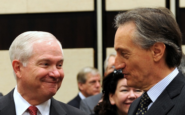 Secretary Gates speaks with NATO Deputy Secretary General Claudio Bisogniero.
