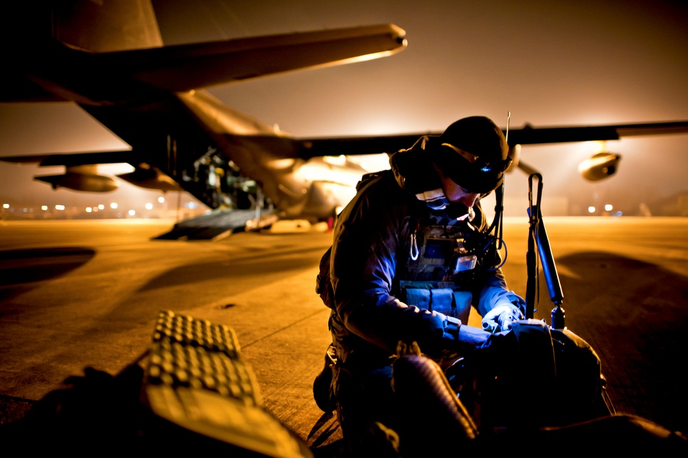 Tech. Sgt. Ray Decker prepares his rucksack before boarding an MC-130P Combat Shadow.
