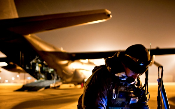 Tech. Sgt. Ray Decker prepares his rucksack before boarding an MC-130P Combat Shadow.