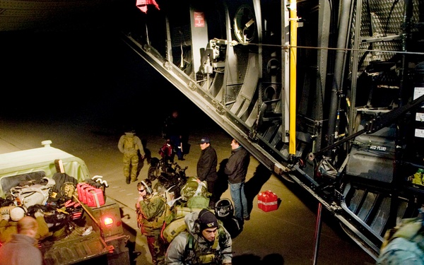 Members of the 353rd Special Operations Group off-load and upload new gear at Sendai Airport, Japan.