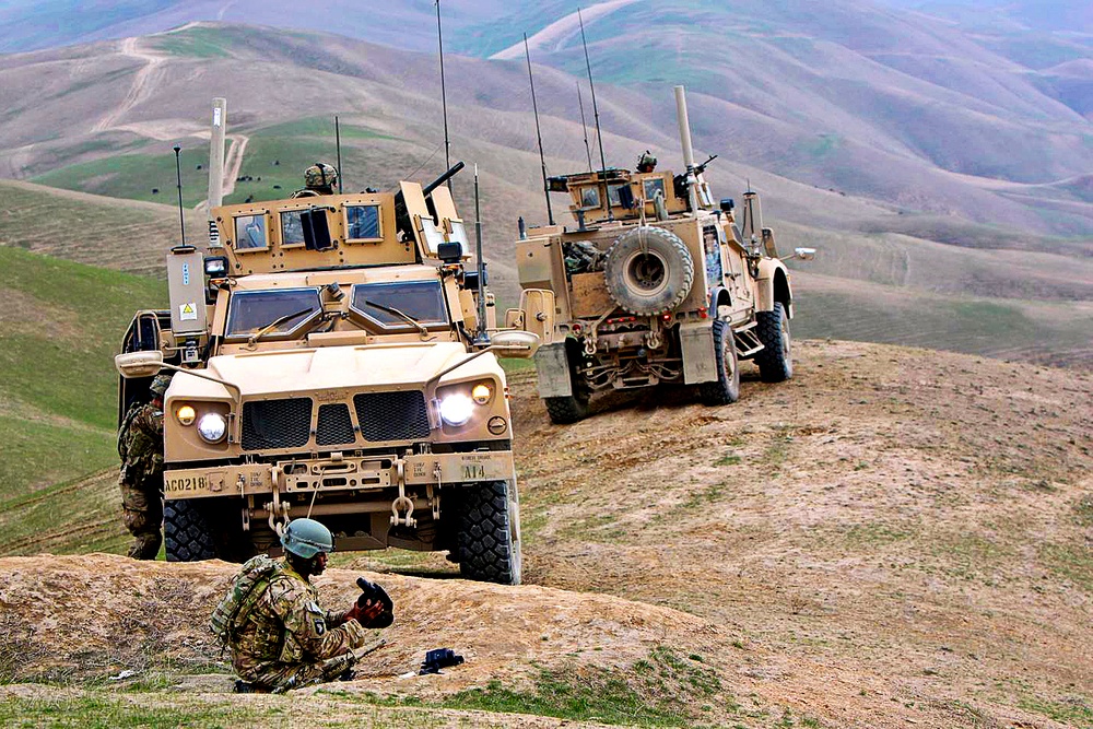 U.S. Army soldiers visit an Afghan police checkpoint.