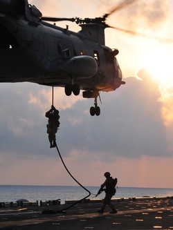 U.S. Marines drop from a CH-46 Sea Knight helicopter.