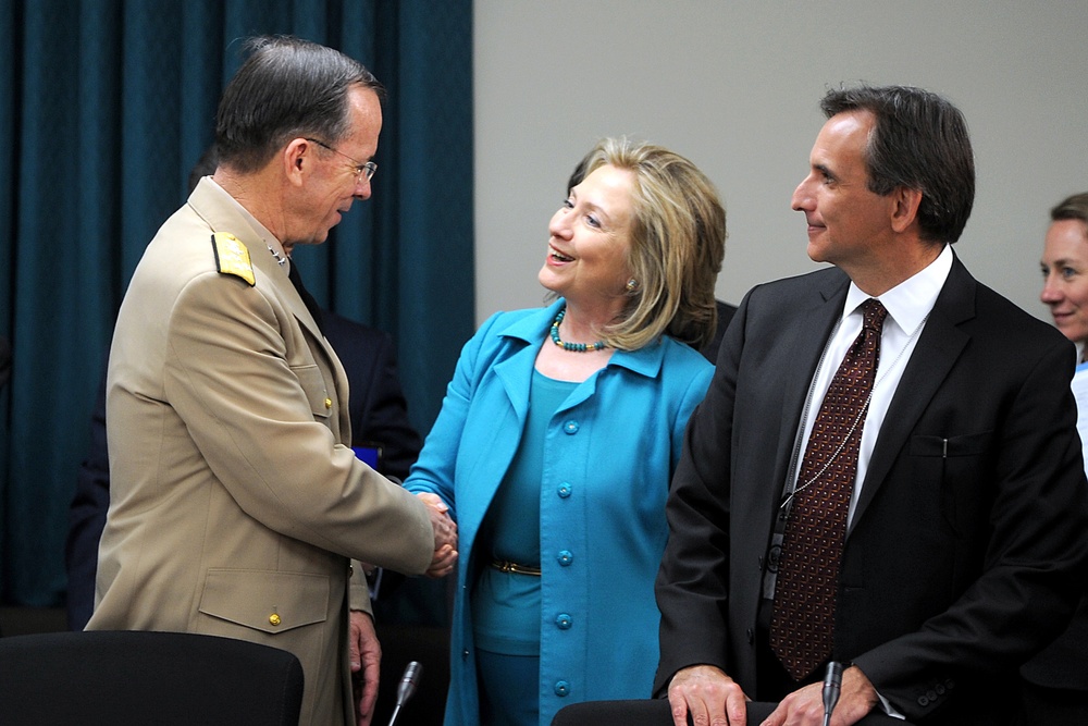 Secretary of State Hillary Clinton greets Adm. Mike Mullen.