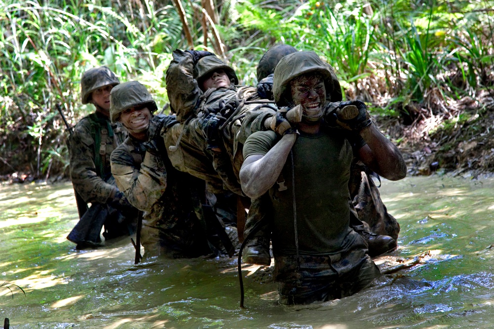 U.S. Marines carry an exercise participant simulating injury.