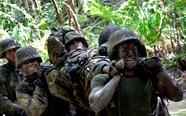 U.S. Marines carry an exercise participant simulating injury.