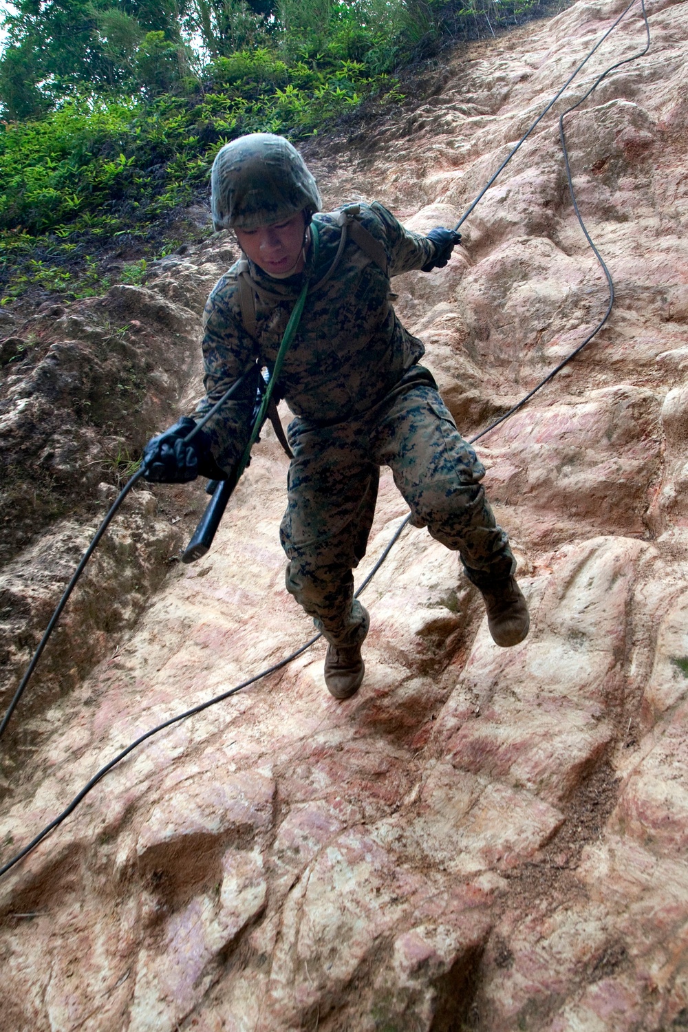 A U.S. Marine participates in the endurance course at the Jungle Warfare Training Center.