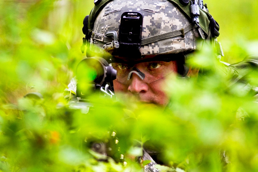 Pfc. Dustin Dean provides security behind a machine gun.