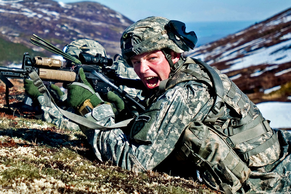 Sgt. 1st Class Kyle Silvernale yells commands to his troops during air assault training.