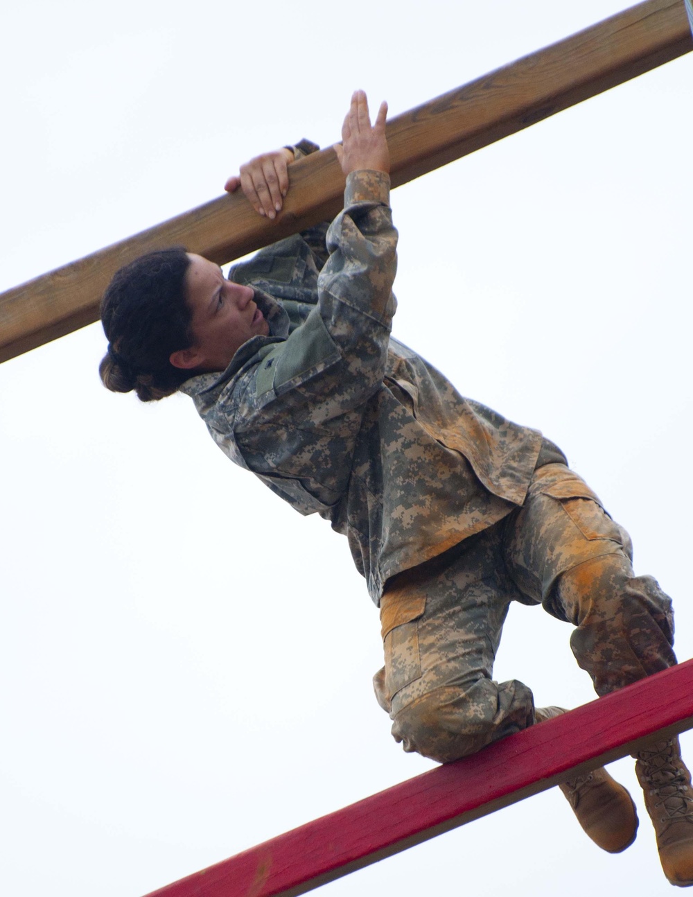 Sgt. Leah Serrano climbs up a tower ladder during the obstacle course.