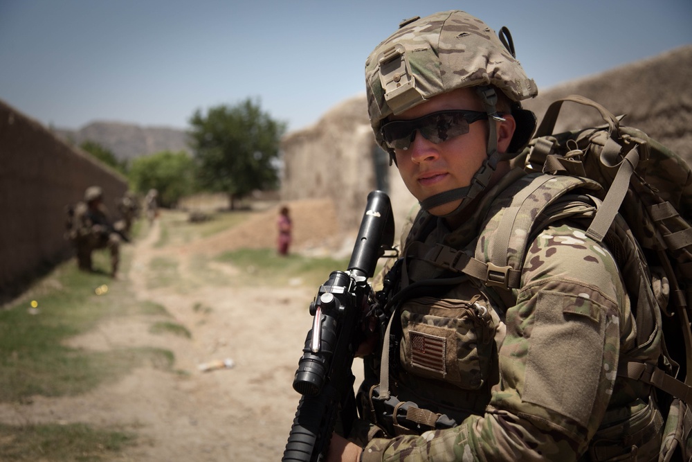 Spc. Josh Brimm stands guard along a dirt road near Malajat.