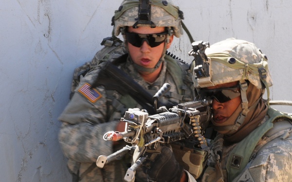 U.S. Army soldiers fire at the enemy as part of a training mission.