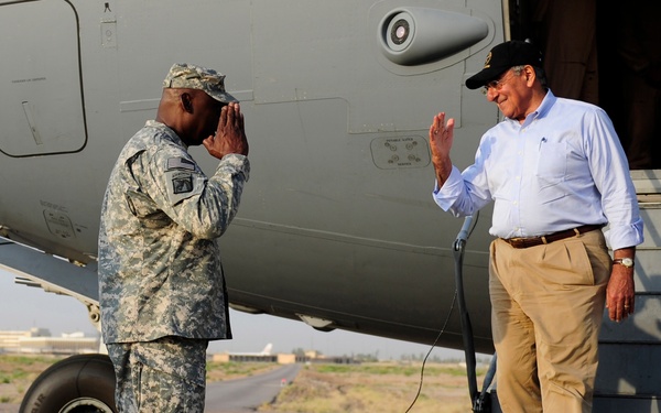 Secretary Panetta is saluted by Gen. Lloyd J. Austin III as he arrives in Baghdad.