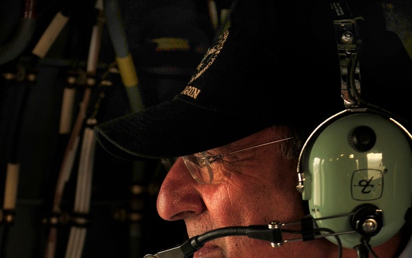 Secretary Panetta rides aboard a UH-60 Blackhawk helicopter over Baghdad.
