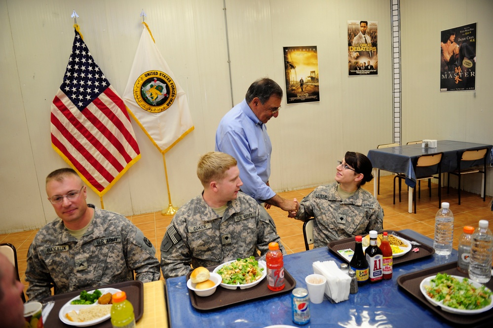 Secretary Panetta meets with troops for lunch at a dining facility at Camp Victory.