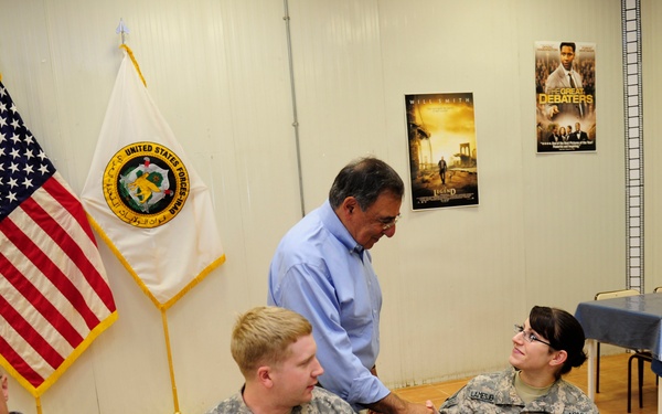 Secretary Panetta meets with troops for lunch at a dining facility at Camp Victory.