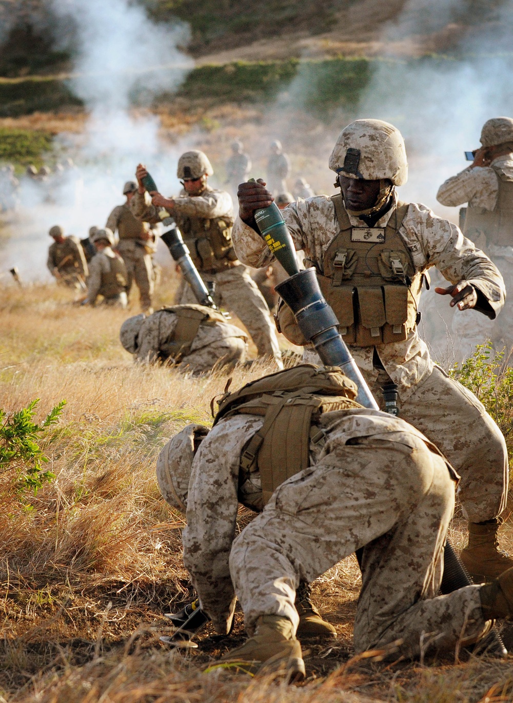 Cpl. Jesse Williamsloads an M252 mortar during a training exercise.
