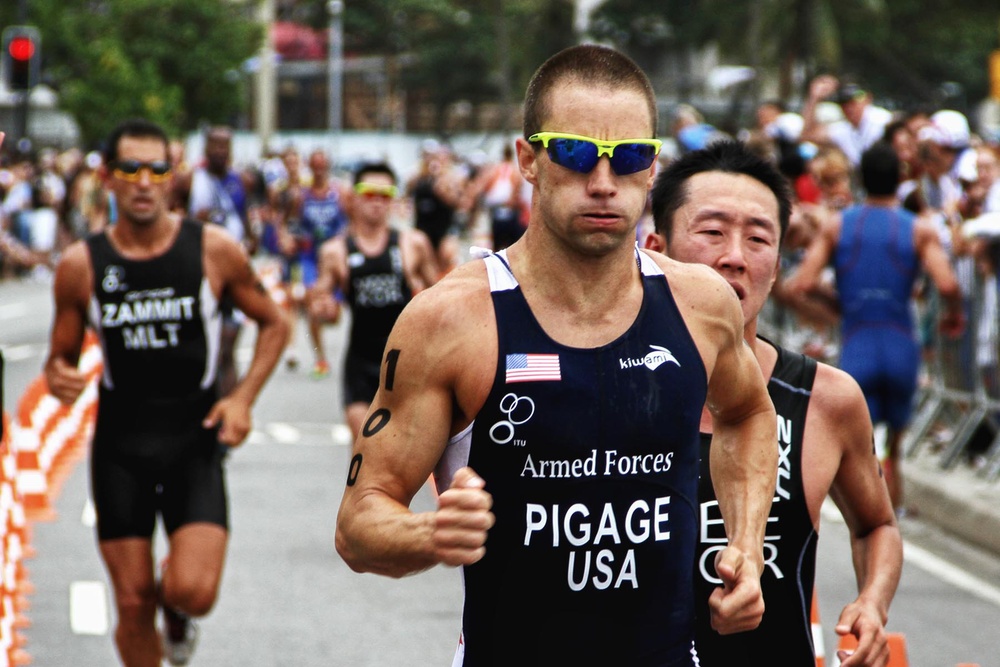 Petty Officer 2nd Class Bradley Pigage races in the triathlon event at the 5th International Military Sports Council World Games.