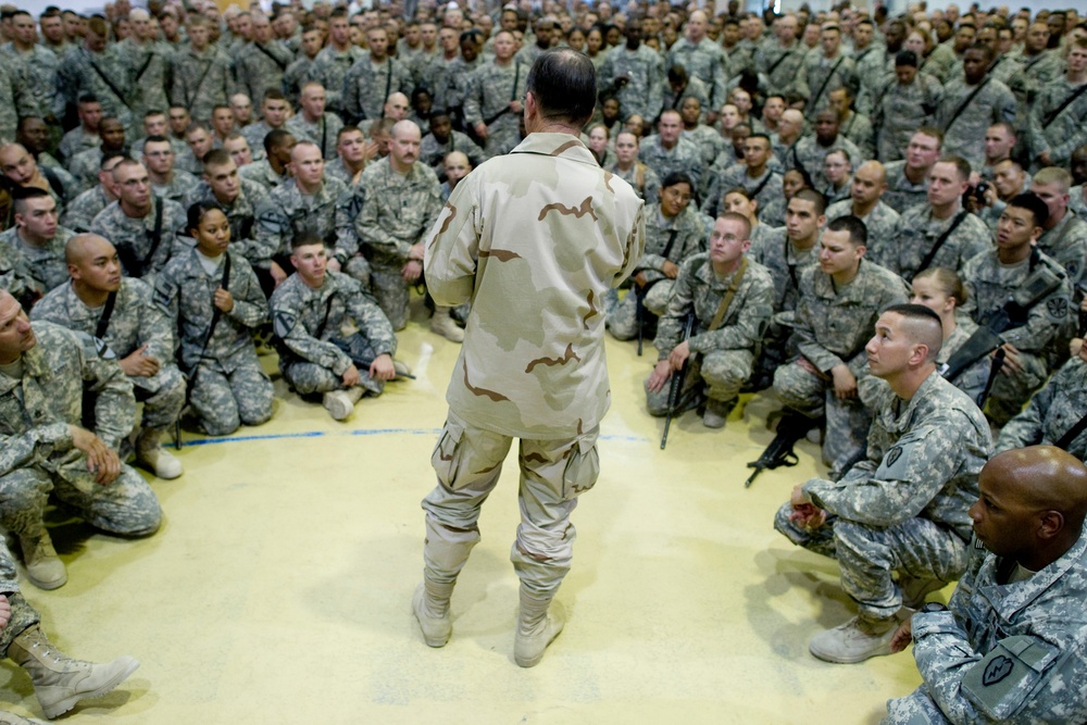 Adm. Mike Mullen addresses service members at an all-hands call at Forward Operating Base Marez.