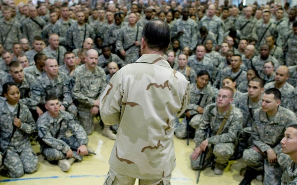 Adm. Mike Mullen addresses service members at an all-hands call at Forward Operating Base Marez.