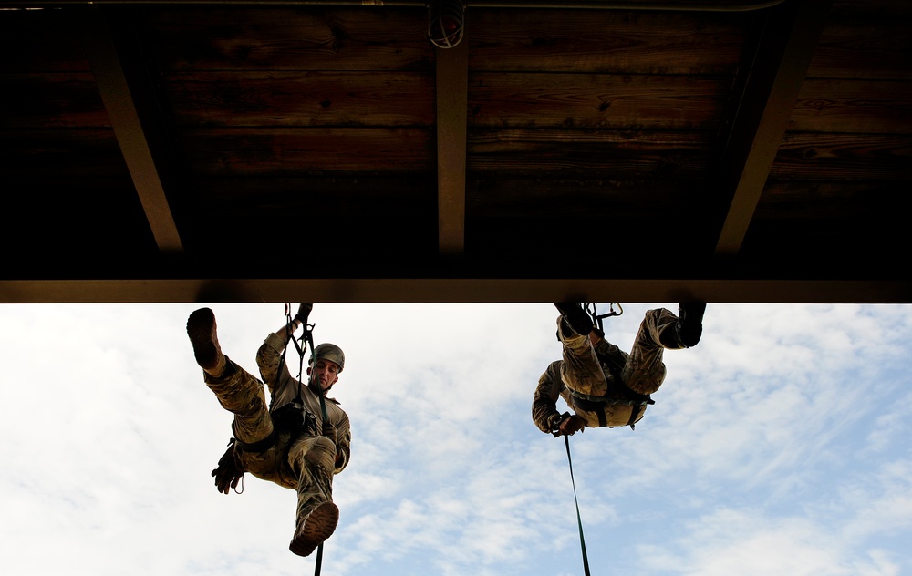 Air Force pararescuemen take part in a rappelling training course