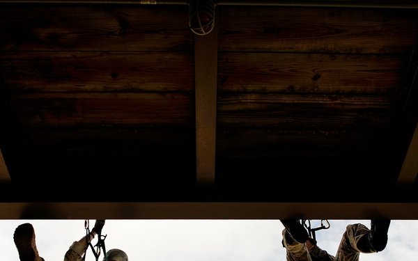 Air Force pararescuemen take part in a rappelling training course