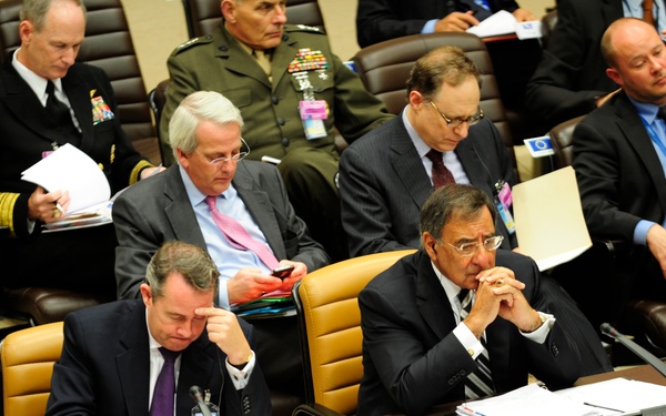Secretary Panetta listens during the Defense Ministerial at NATO
