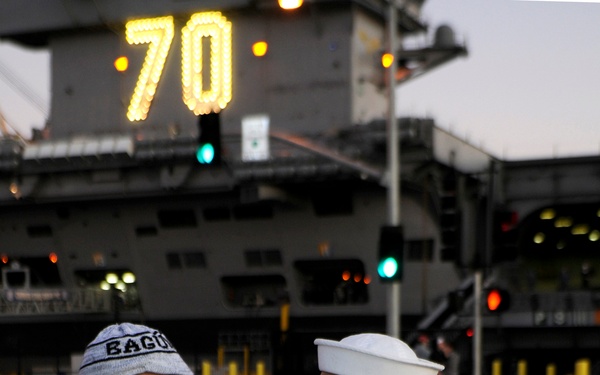 Petty Officer 3rd Class Teejay Sunglao says goodbye to his son.