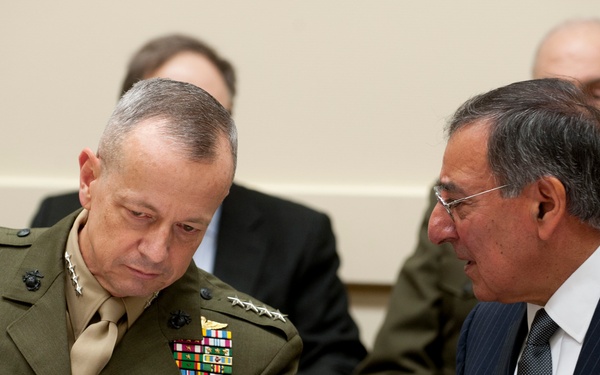 Secretary Panetta speaks with Gen. John Allen at the meeting of NATO defense ministers in Brussels.