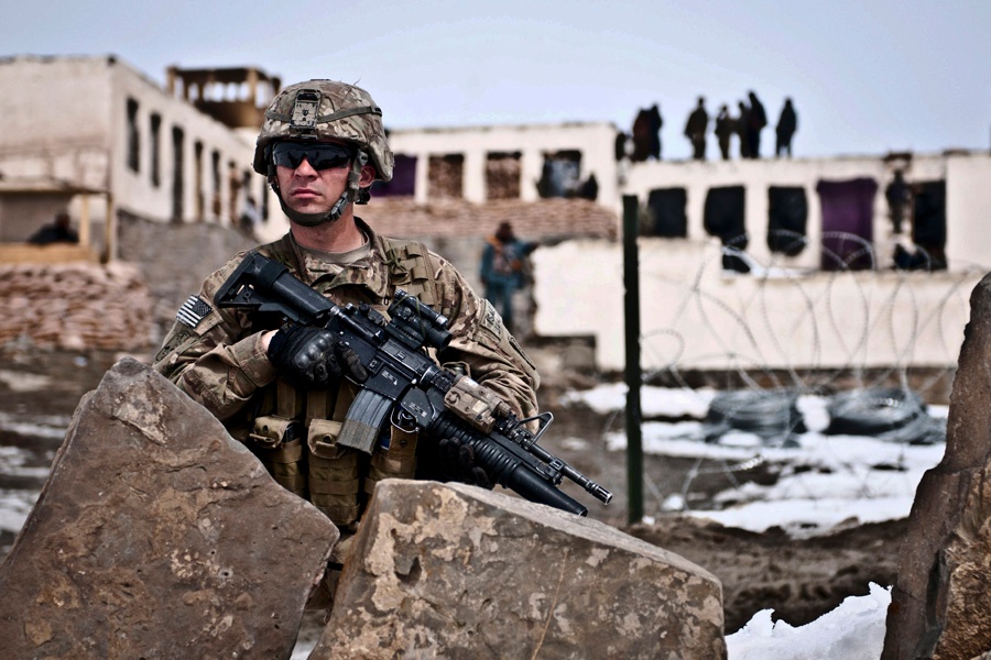 Pvt. Anthony McCarthy keeps watch outside an Afghan local police checkpoint.