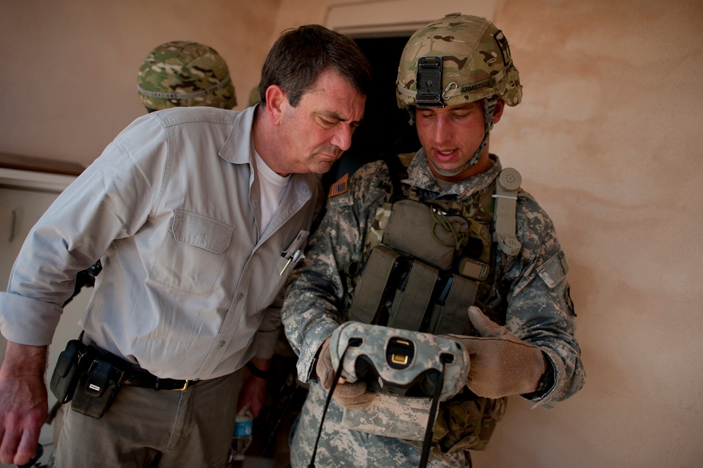 Sgt. Donald Armstrong explains a biometric scanning system to Deputy Secretary Carter