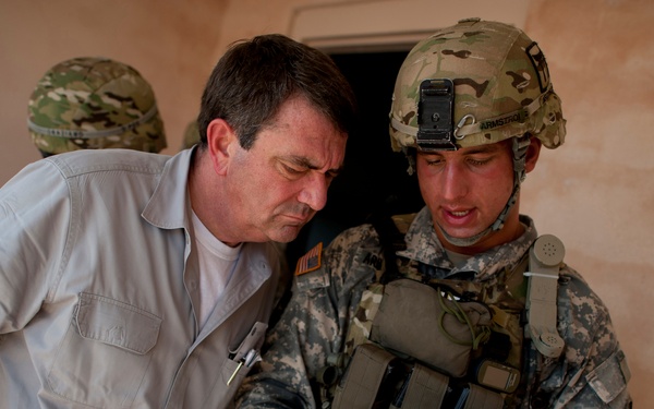 Sgt. Donald Armstrong explains a biometric scanning system to Deputy Secretary Carter