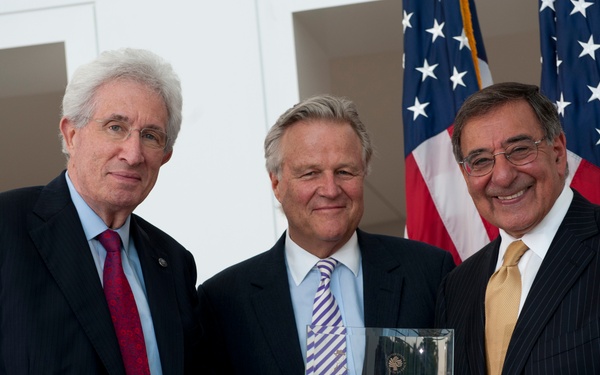 Richard H. Solomon and J. Robinson West present Secretary Panetta with the Dean Acheson Award