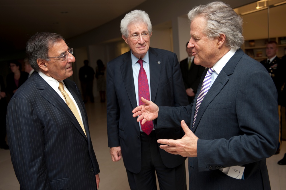 Secretary Panetta speaks with Richard H. Solomon and J. Robinson West