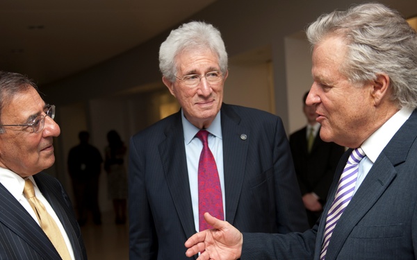 Secretary Panetta speaks with Richard H. Solomon and J. Robinson West