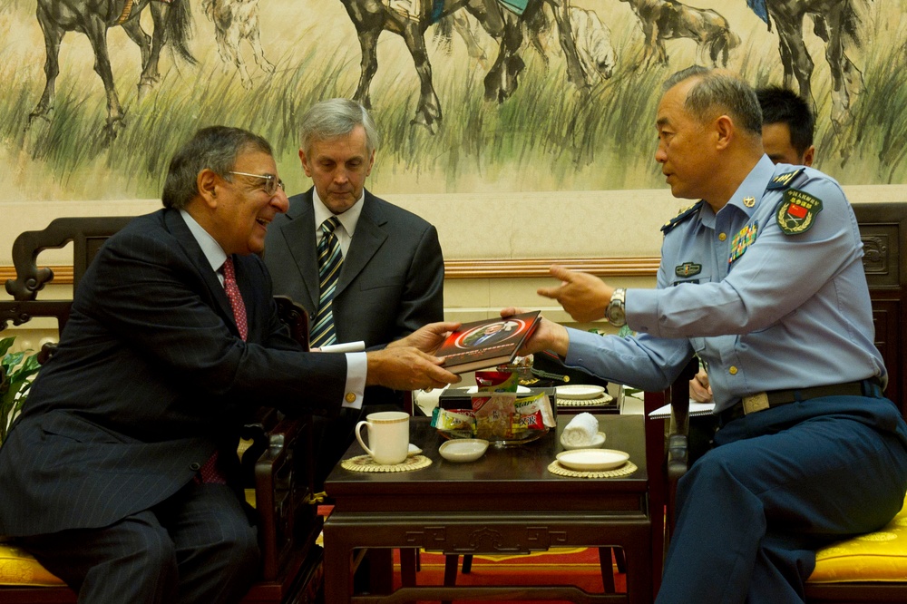 Gen. Ma Xiaotian presents Secretary Panetta with a book
