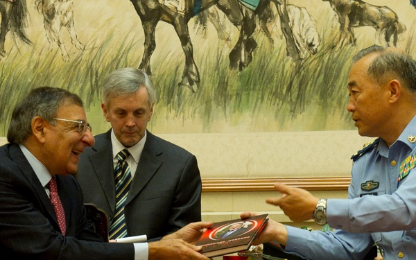 Gen. Ma Xiaotian presents Secretary Panetta with a book