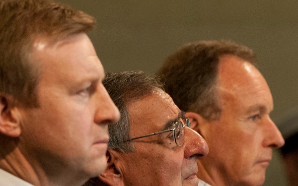 Secretary Panetta stands with Minister Coleman and Museum Director Clare.