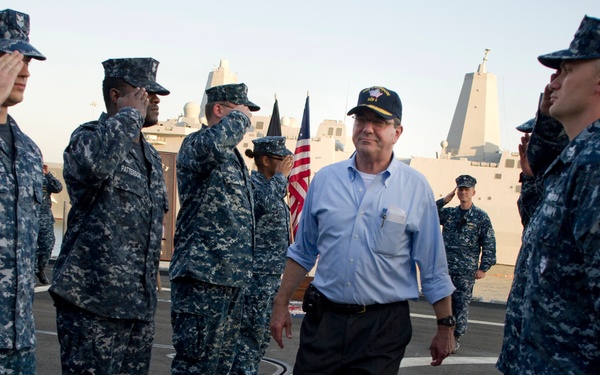Deputy Secretary Carter goes through the sideboys as he is piped ashore after visiting the USS Freedom