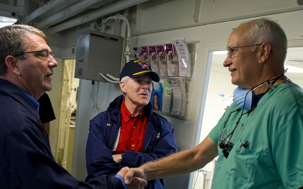 Deputy Secretary Carter and Navy Secretary Mabus greet Lt. Cmdr. Howard Hall onboard the USS Makin Island