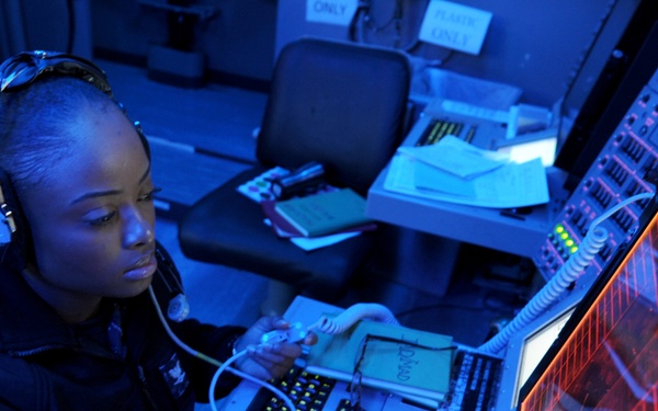 U.S. Navy Petty Officer 3rd Class Diles monitors a ship self-defense system console aboard the USS Nimitz