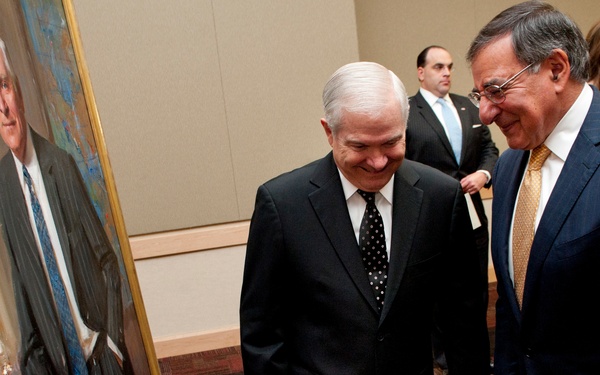 Secretary Panetta and former Secretary Gates share a laugh