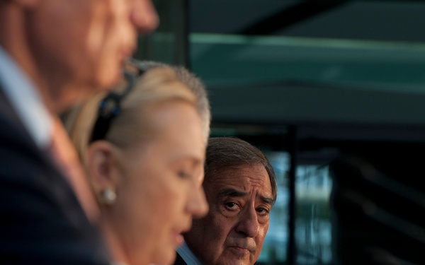 Secretary Panetta listens to Secretary Clinton during a joint press conference with Australian Ministers