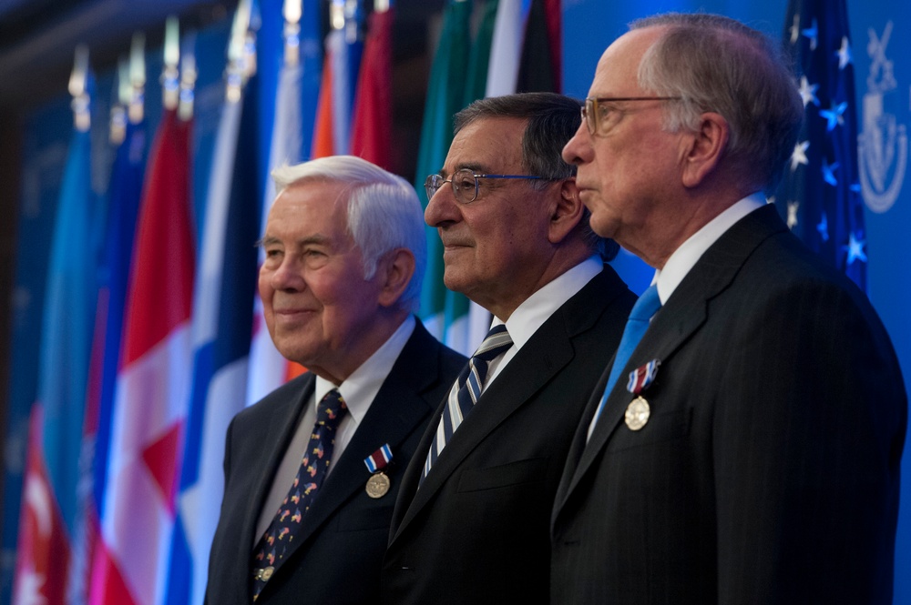 Sen. Lugar, Secretary Panetta, and Sen. Nunn pose for photographs